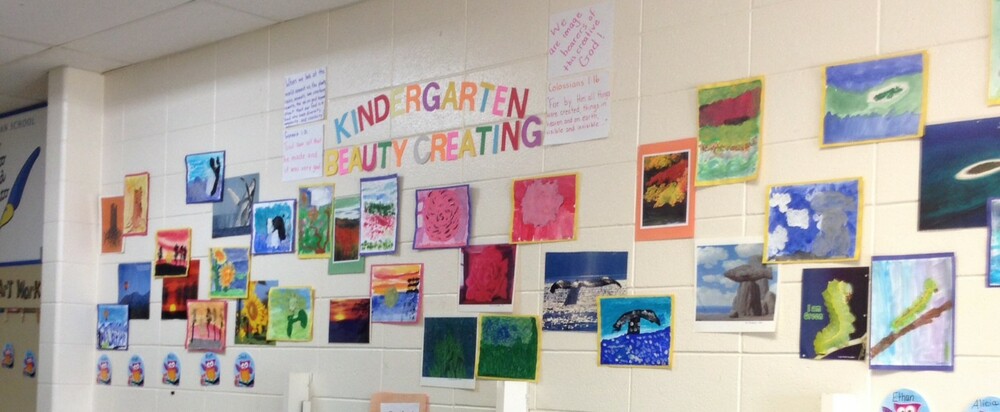 artwork by kindergarteners on school hallway wall